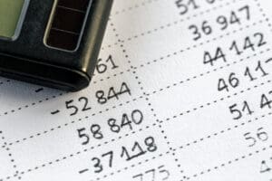 Close-up of a calculator and numbers on paper illustrating the current ratio formula concept